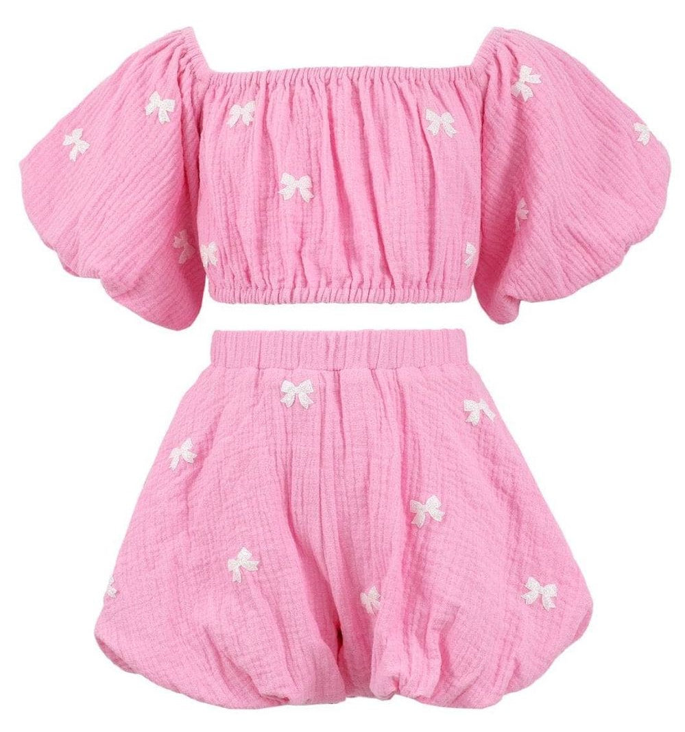 lola and the boys outfit with puff sleeves and bow details on a white background