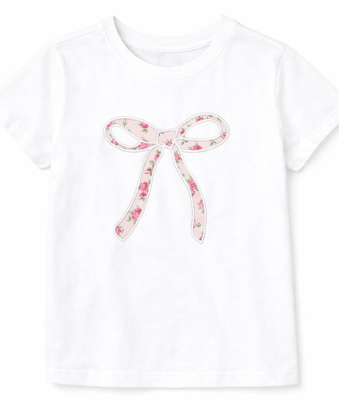 girls shirt with a pink floral bow on a white background