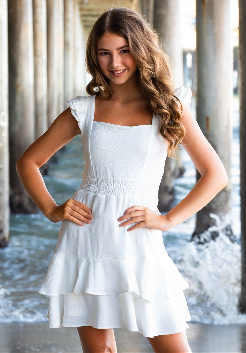 tween girl in a white dress for graduation