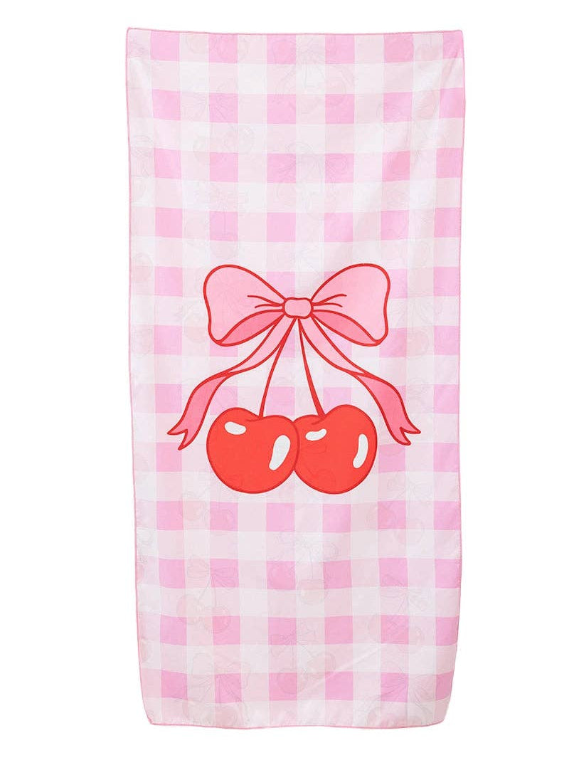 beach Towel with pink checkered pattern, red cherries, and a bow on a white background