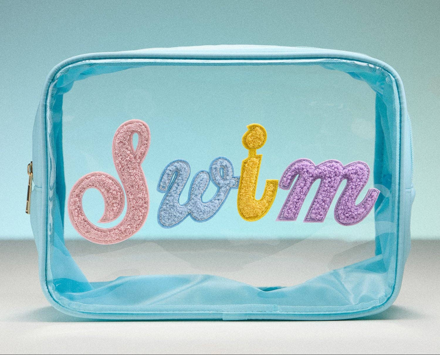 Clear blue pouch with 'Swim' text in colorful letters on a light blue background