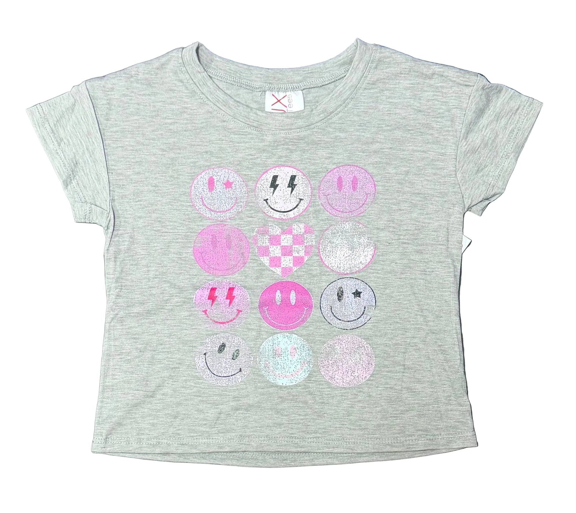 A heather gray short-sleeve t-shirt for kids, featuring a grid of nine pink and purple smiley face designs on the front, laid flat on a dark gray tiled surface.