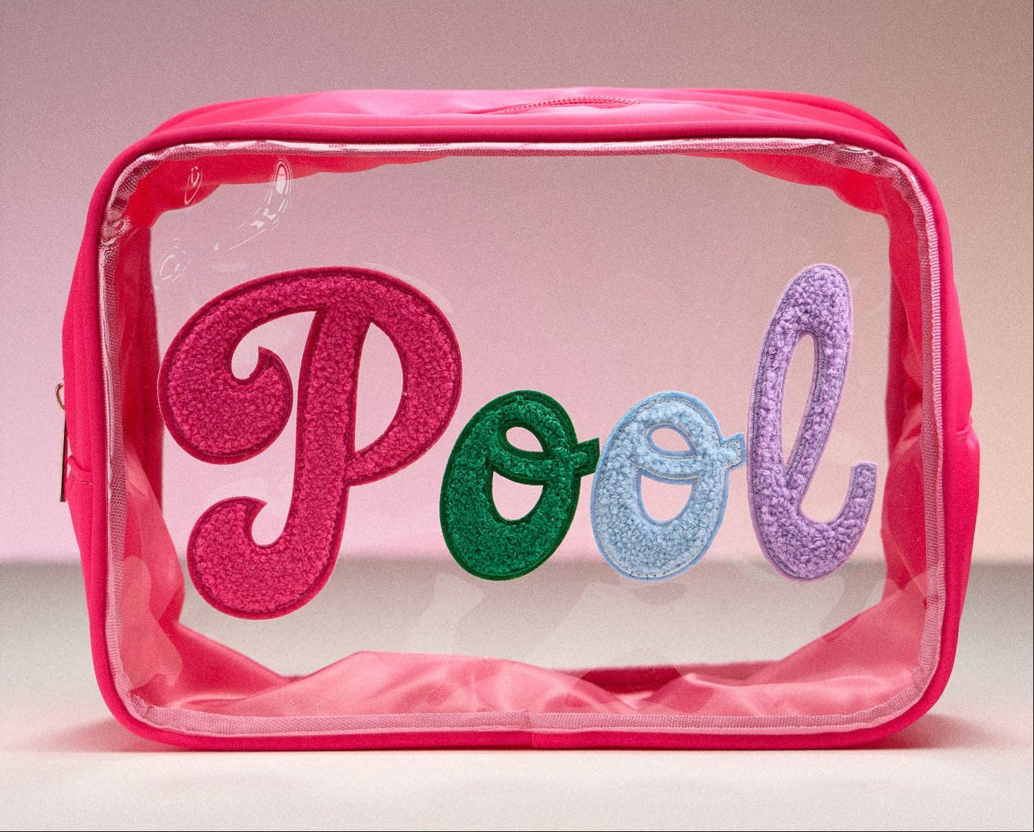 Clear pouch with pink, green, blue, and purple letters spelling 'Pool' on a pink background