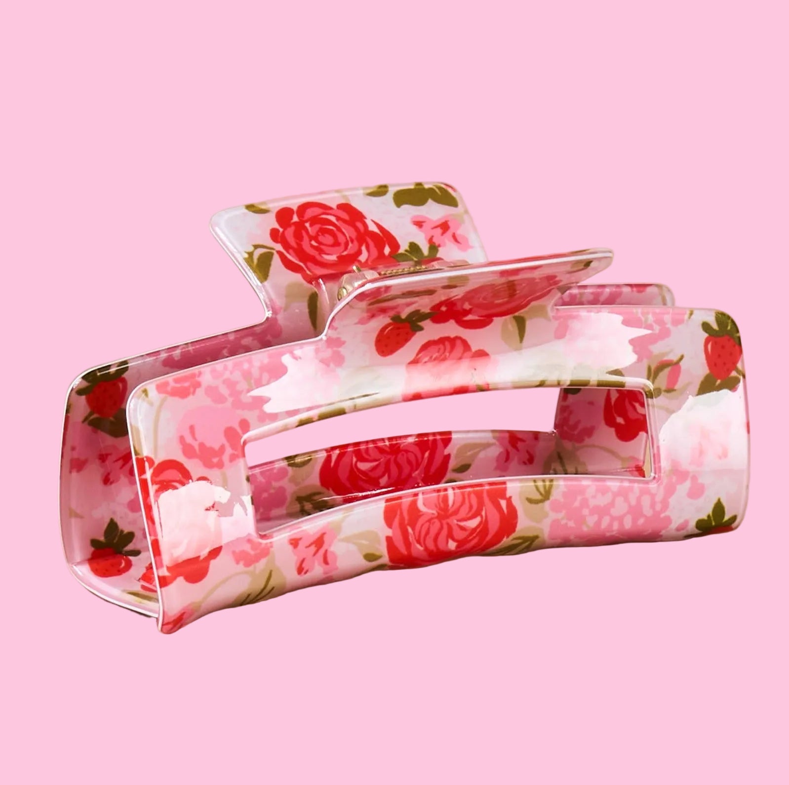 Floral patterned hair clips on a beige background