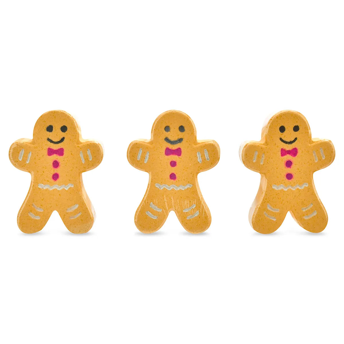 Three gingerbread cookie shaped Iscream Sugar and Spice bath bombs with pink bows