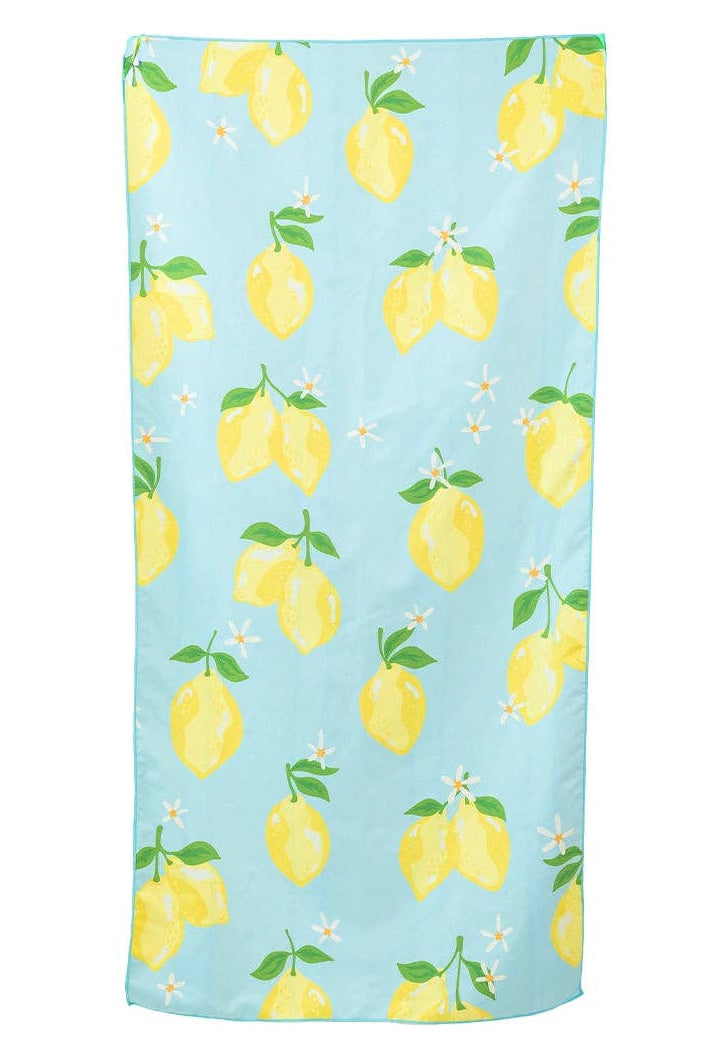 beach Towel with lemon pattern on a light blue background