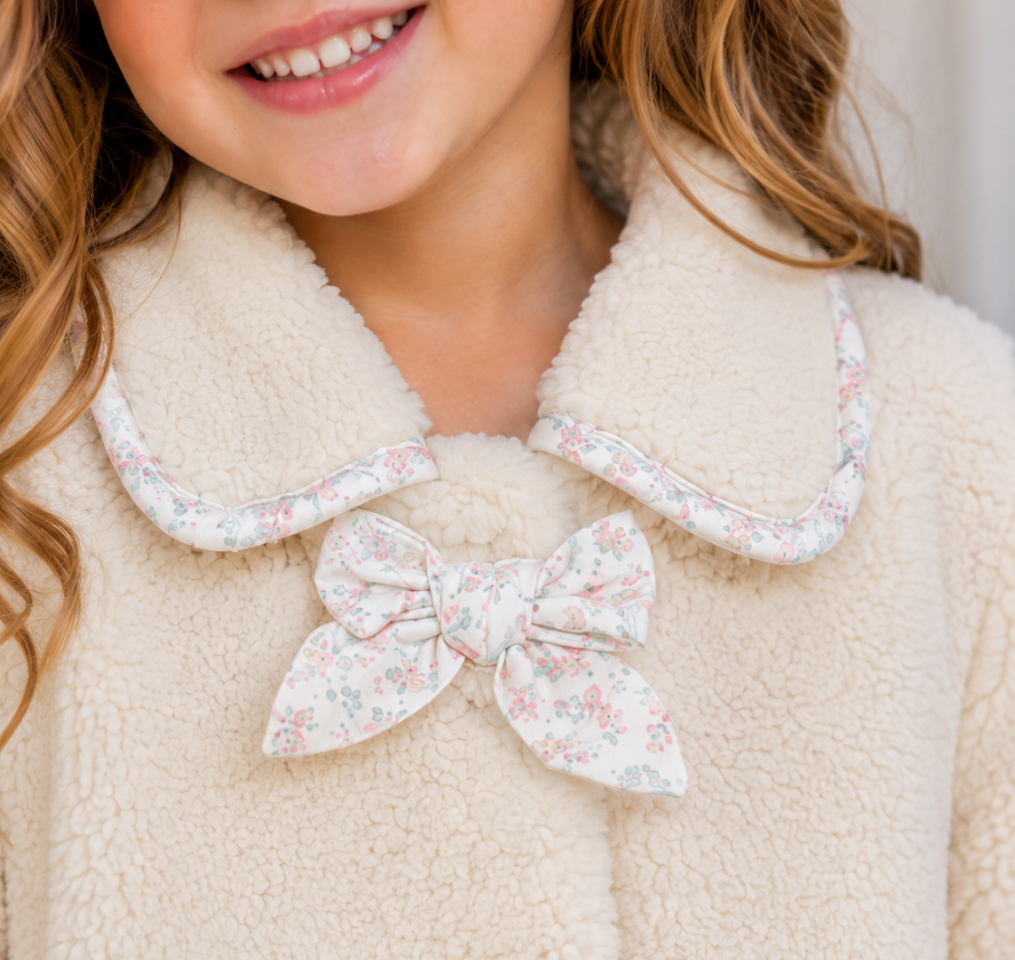 Ivory girls sherpa jacket with floral trim and bow details