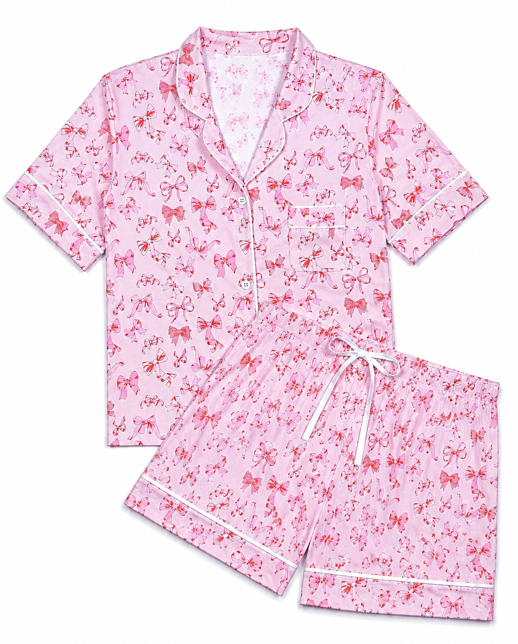 A two-piece short-sleeve tween girls lounge by KatieJ NYC set in light pink with a red bow and floral print, featuring a button-front top with a chest pocket and matching drawstring shorts with white piping.