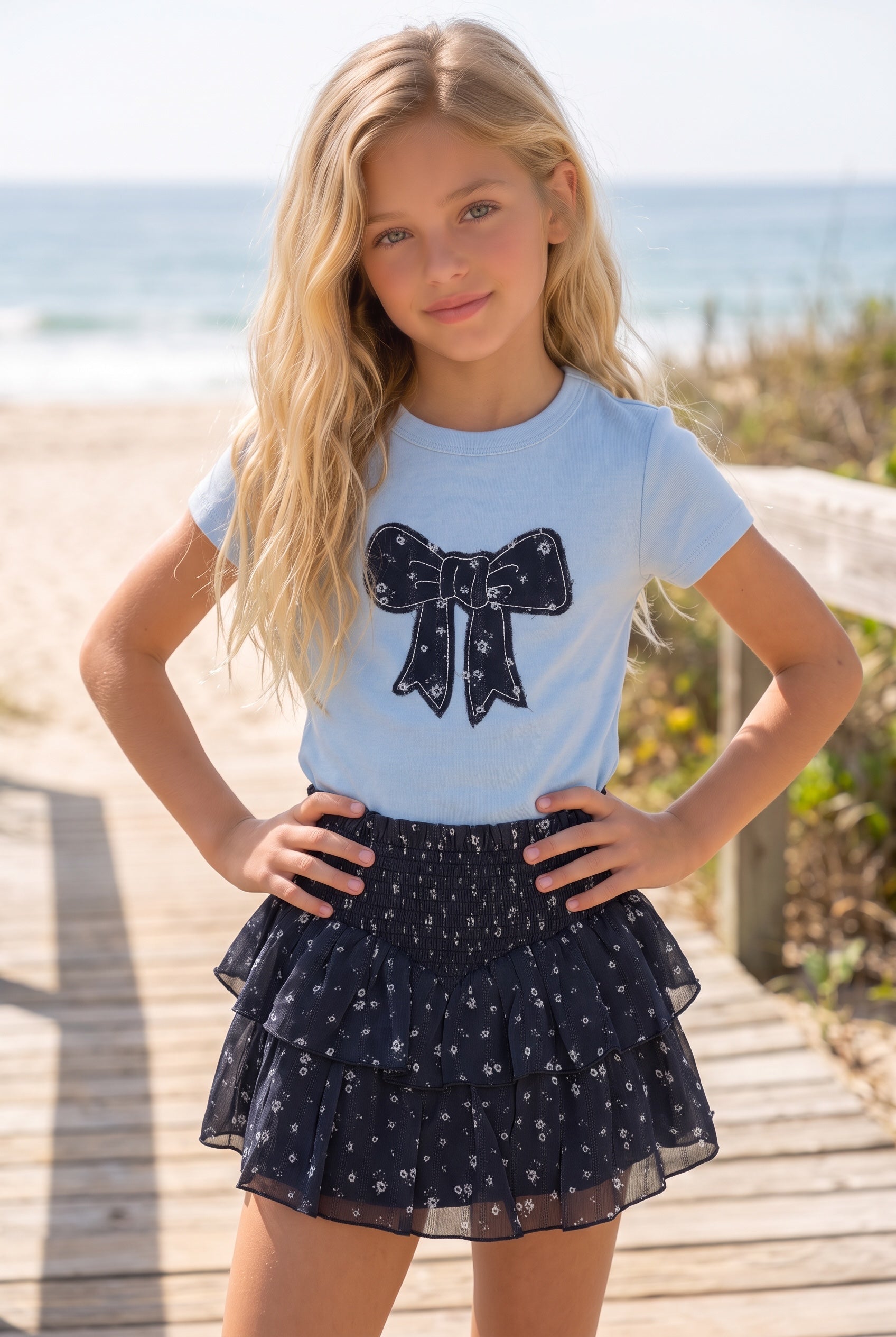 Tween girl wearing a KatieJ Brooke floral tiered skirt in Evening Blue Garden Bloom