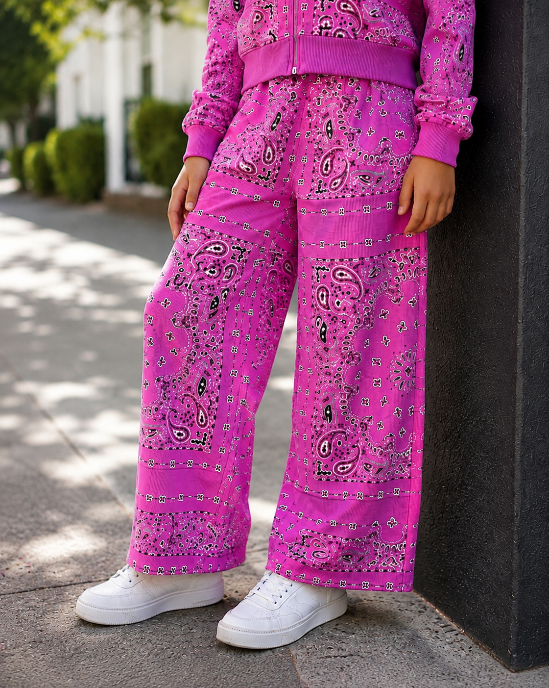 KatieJ NYC Haden hot pink bandana print barrel leg sweatpants modeled on a tween girl outdoors
