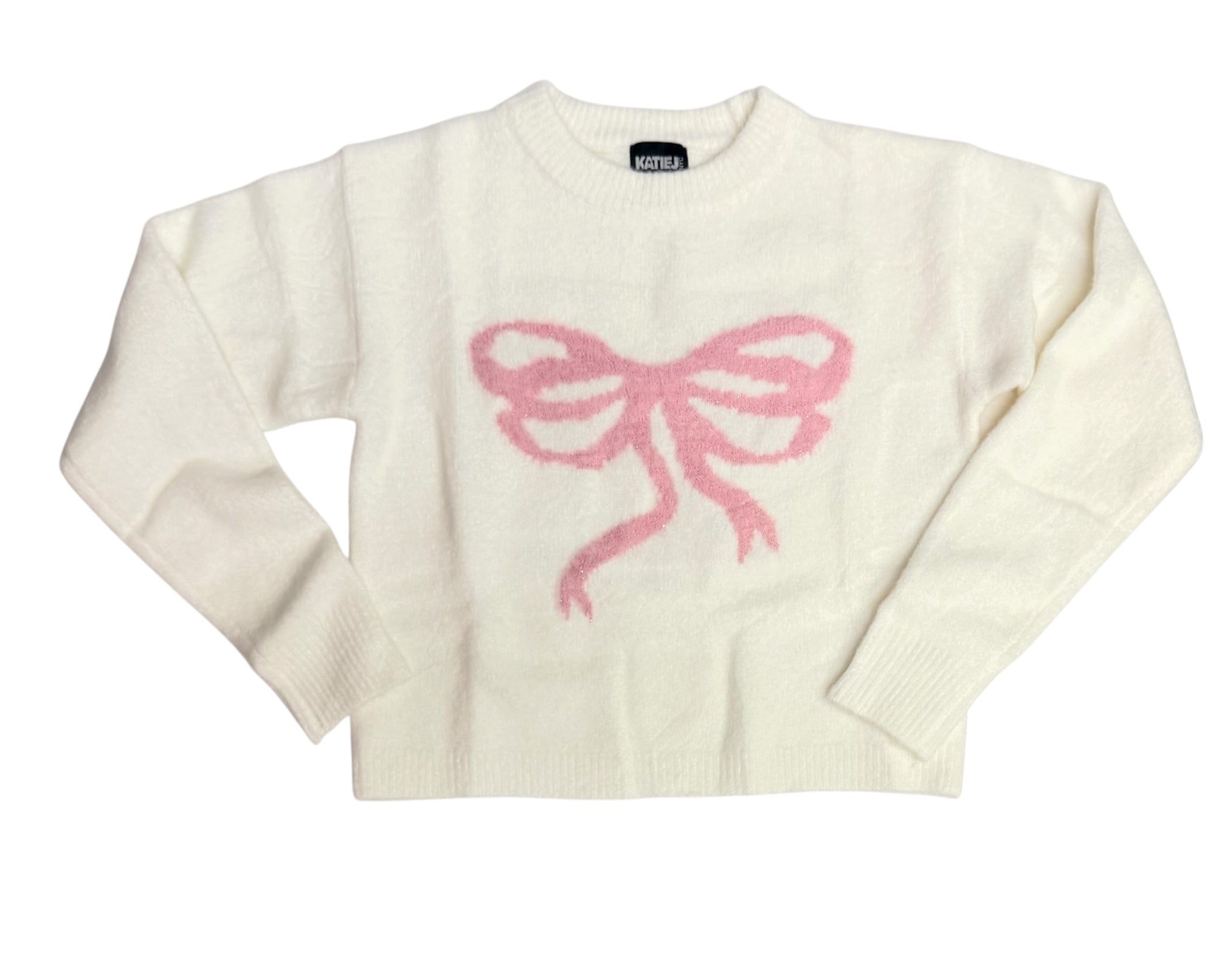 KatieJ NYC Maggie Sweater in ivory featuring a large soft pink bow knit design on the front and a cozy crewneck silhouette.