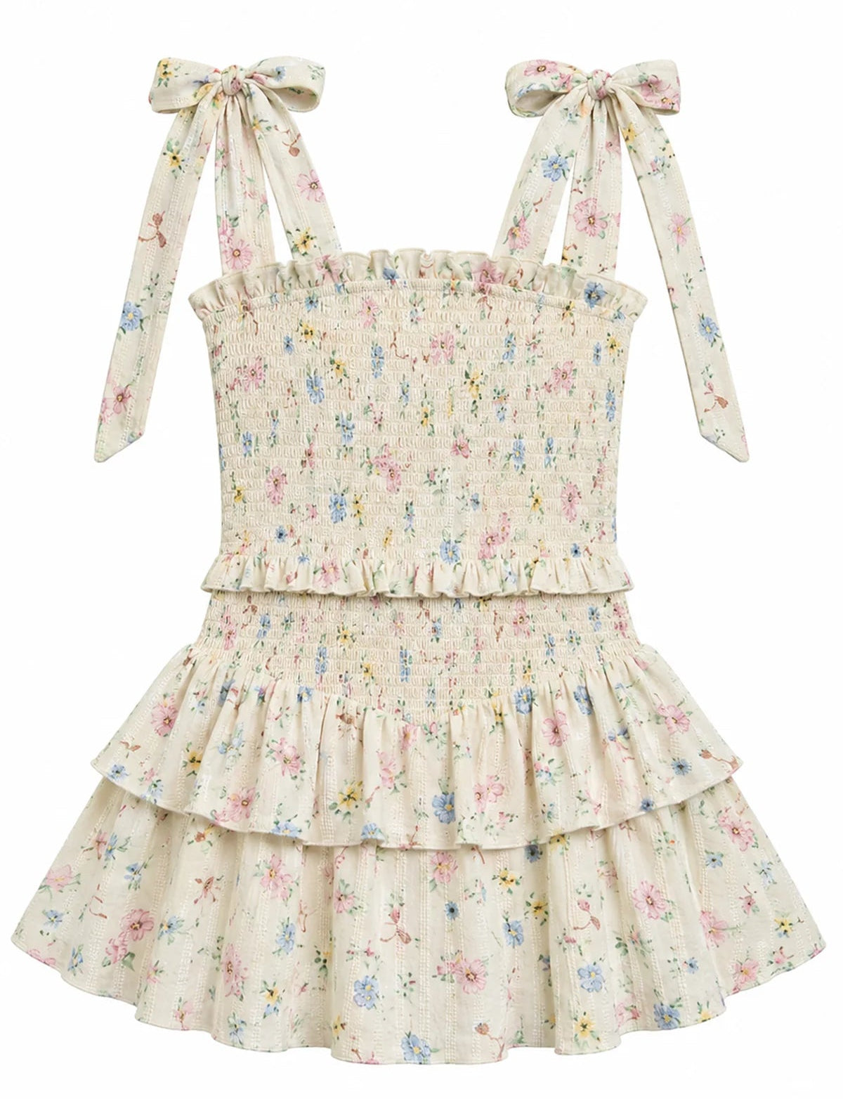 A sleeveless tiered ruffle dress with a smocked bodice, featuring a delicate pastel floral print on a cream background. The dress has wide shoulder straps that tie into bows at the shoulders.