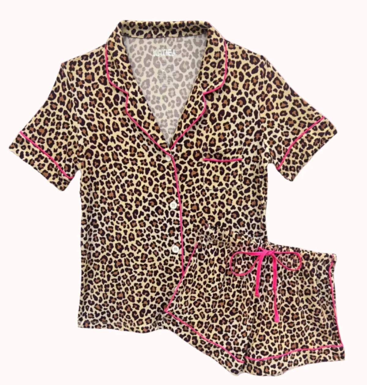 Leopard print pajama set with pink accents on a white background