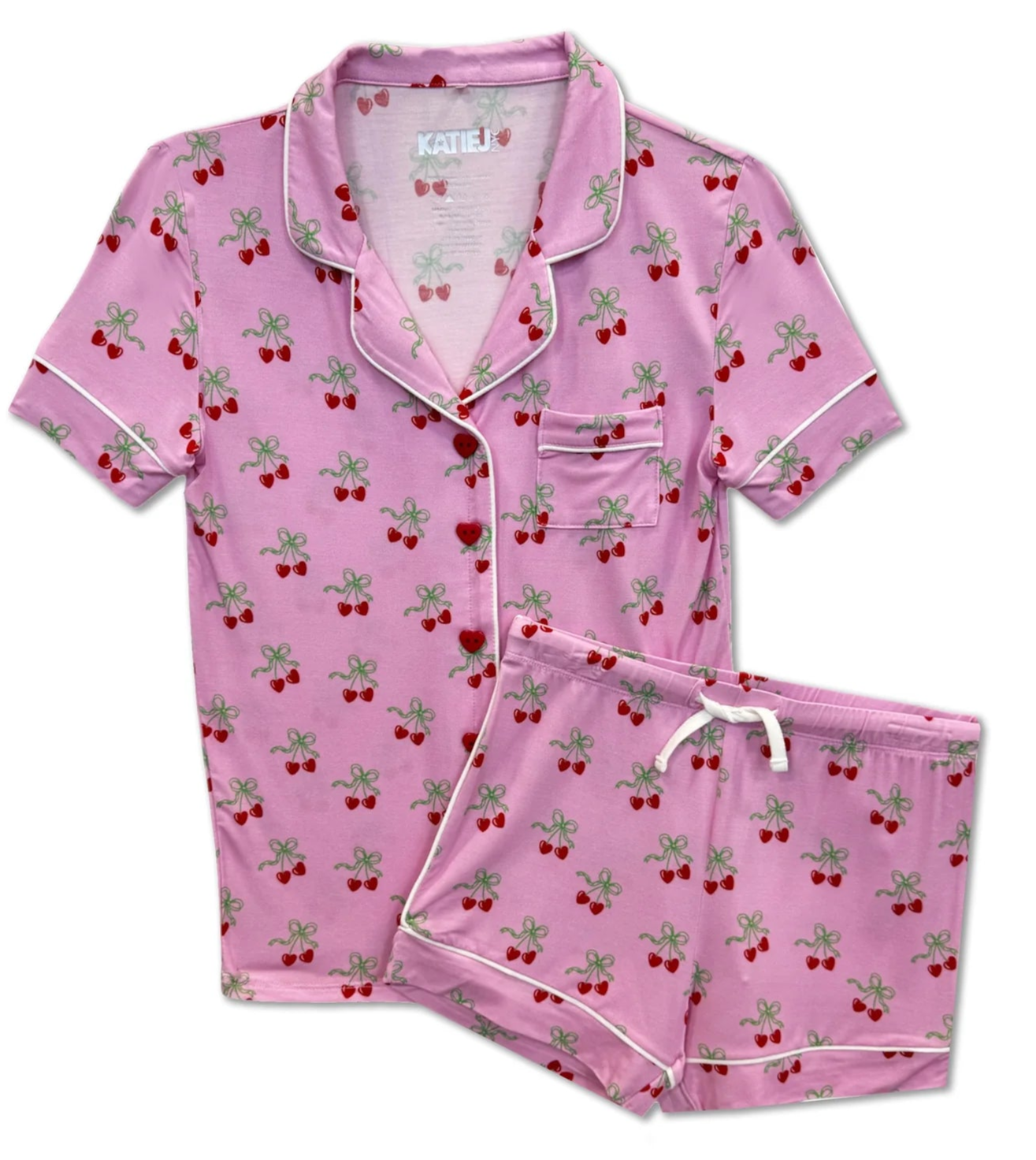 Pink pajama set with cherry pattern on a white background