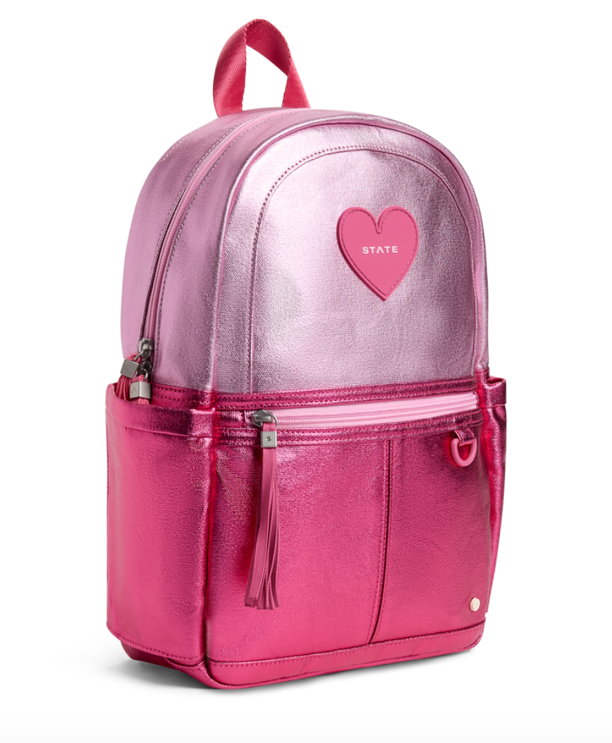 STATE Bags Metallic Ombre Pink Heart preschool backpack with spacious main compartment, front zip pocket, and side water bottle pockets.