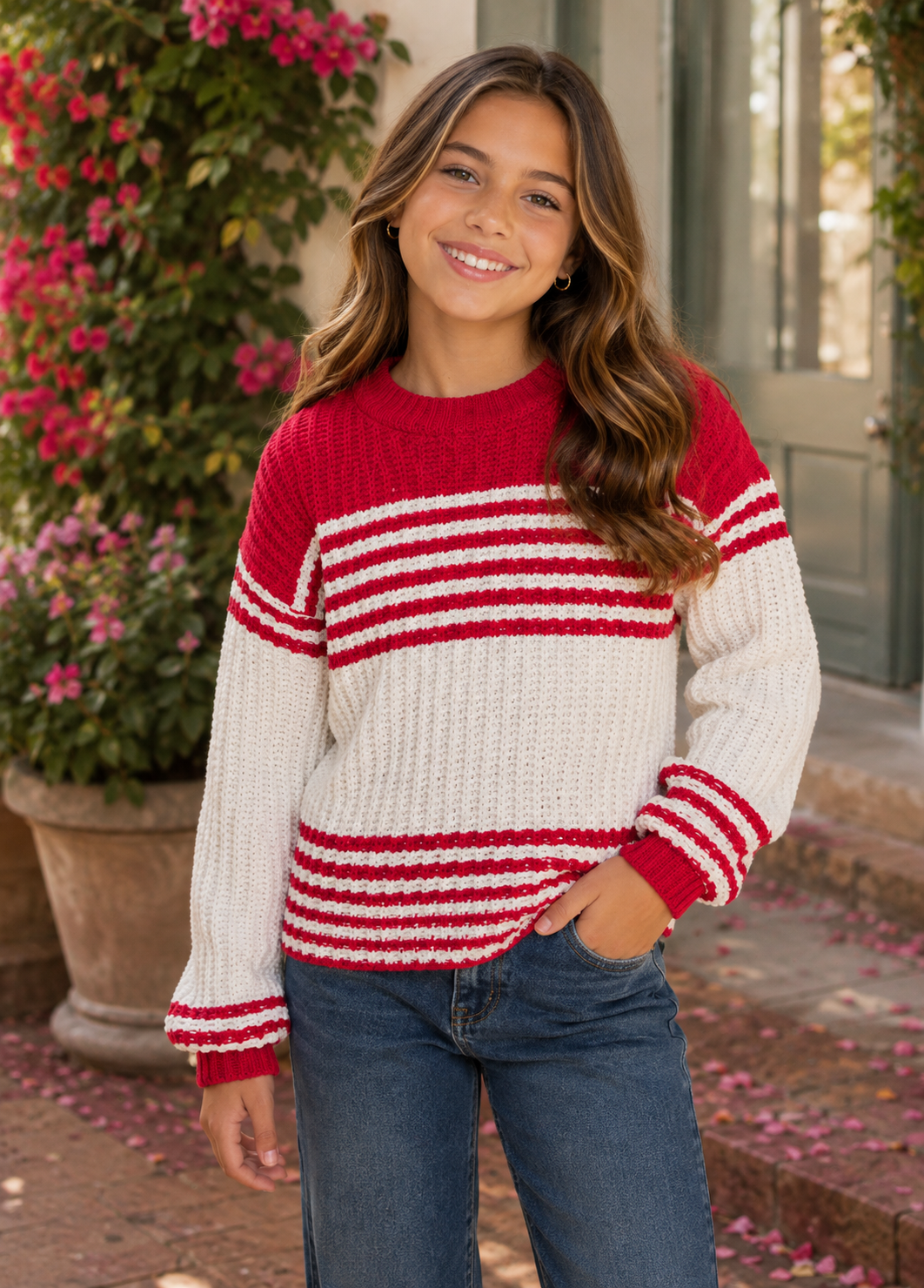 Tween girl wearing red striped sweater for a fall school outfit