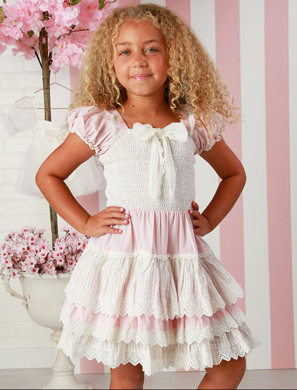 little girl in a pink dress