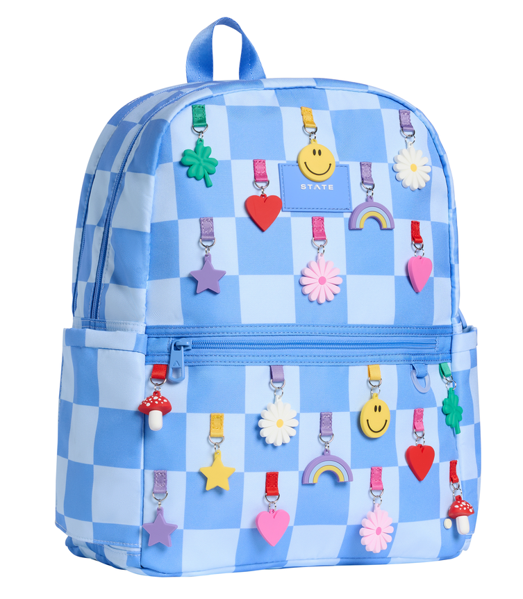 Front view of the STATE Bags Kane Double Pocket Backpack in Charms Blue Check featuring a sky blue gingham pattern with colorful charm-inspired graphics.