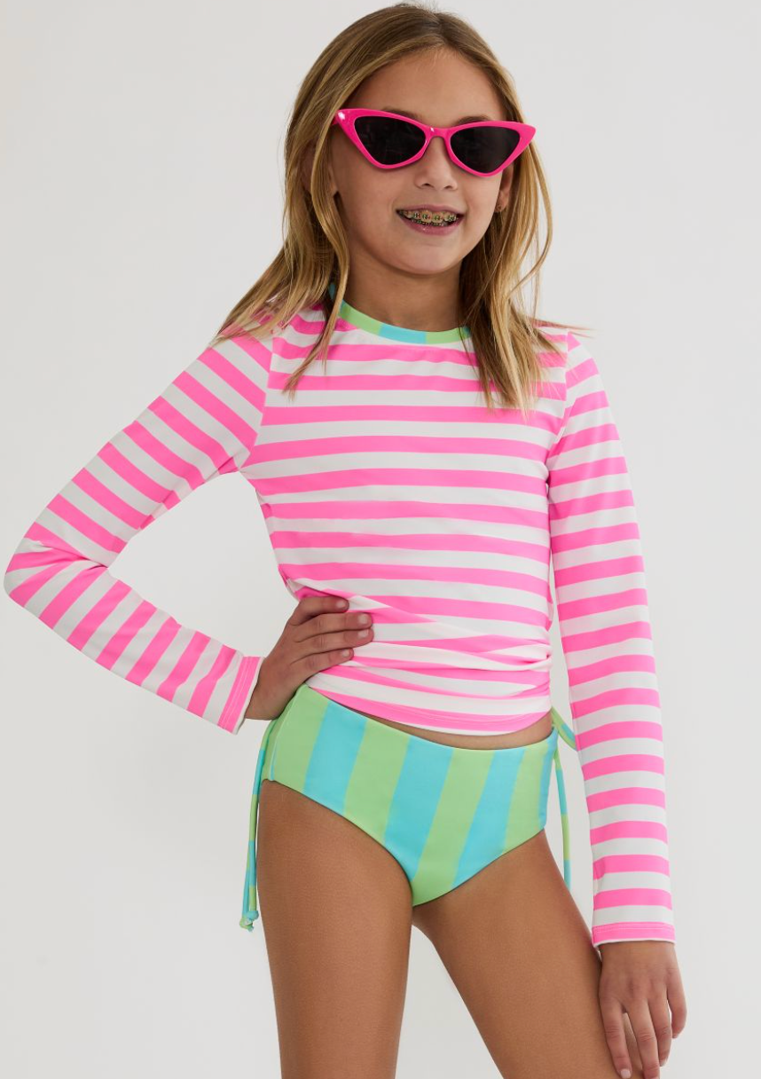 Tween Girl Wearing Beach Riot Kids Pink Stripe Long Sleeve Swimsuit Set
