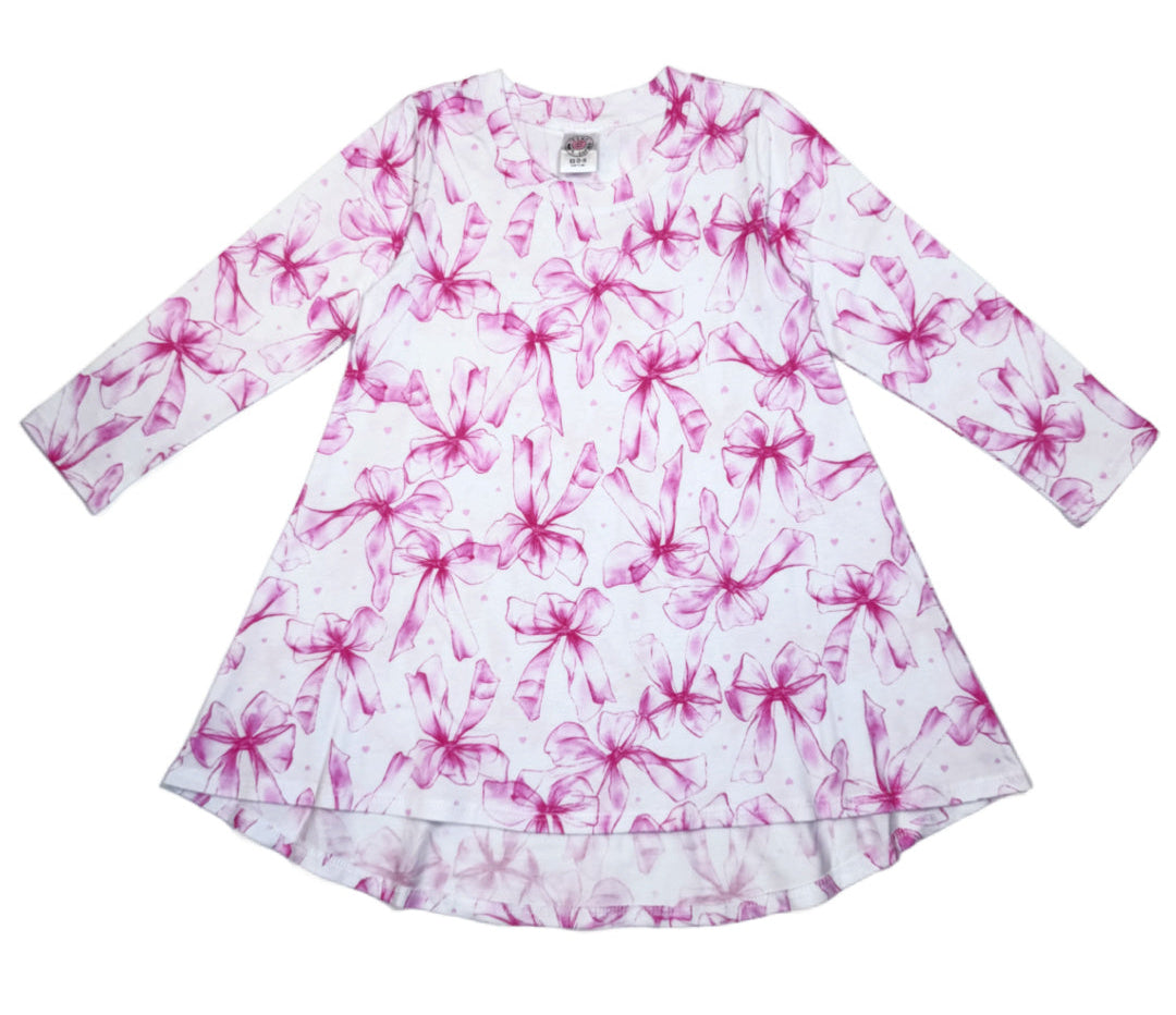 White dress with pink floral pattern on a white background