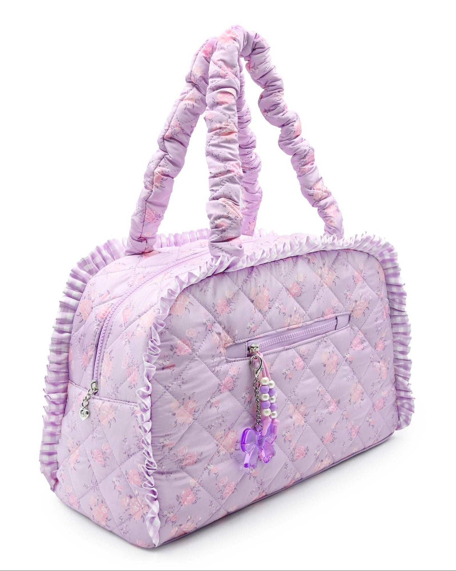 Quilted purple handbag with floral pattern on a white background