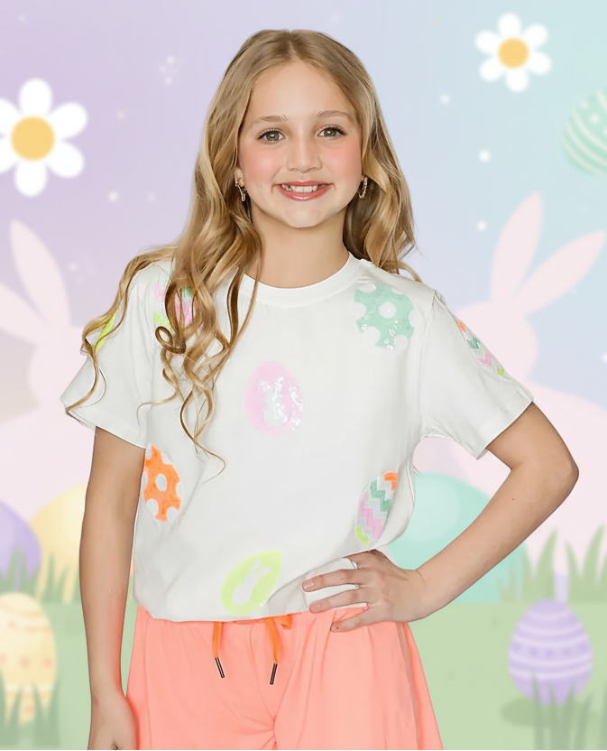 girls casual easter outfit with sequin egg and bunny tee with shorts on a white background 