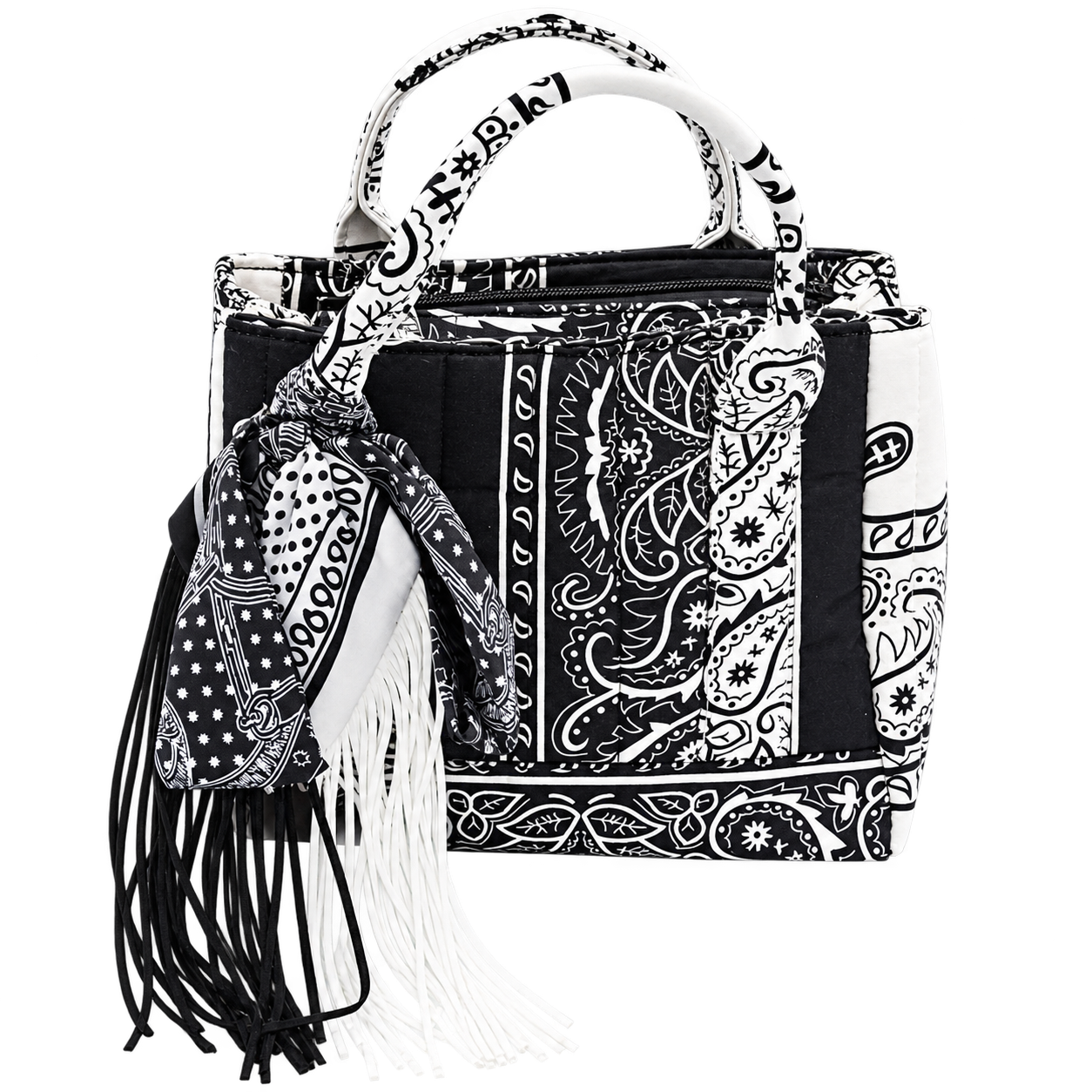 A black and white patterned handbag with a matching scarf draped over one side and black fringe tassels hanging from the handle, shown on a plain white background.