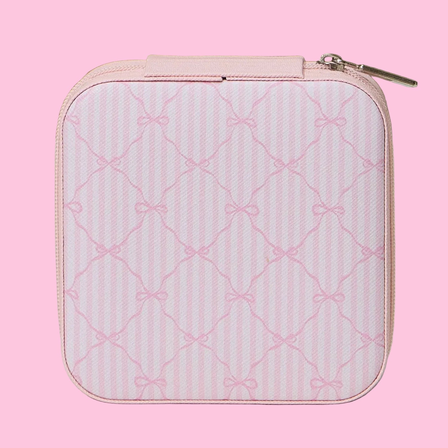 Pink quilted case with bow pattern on a light background