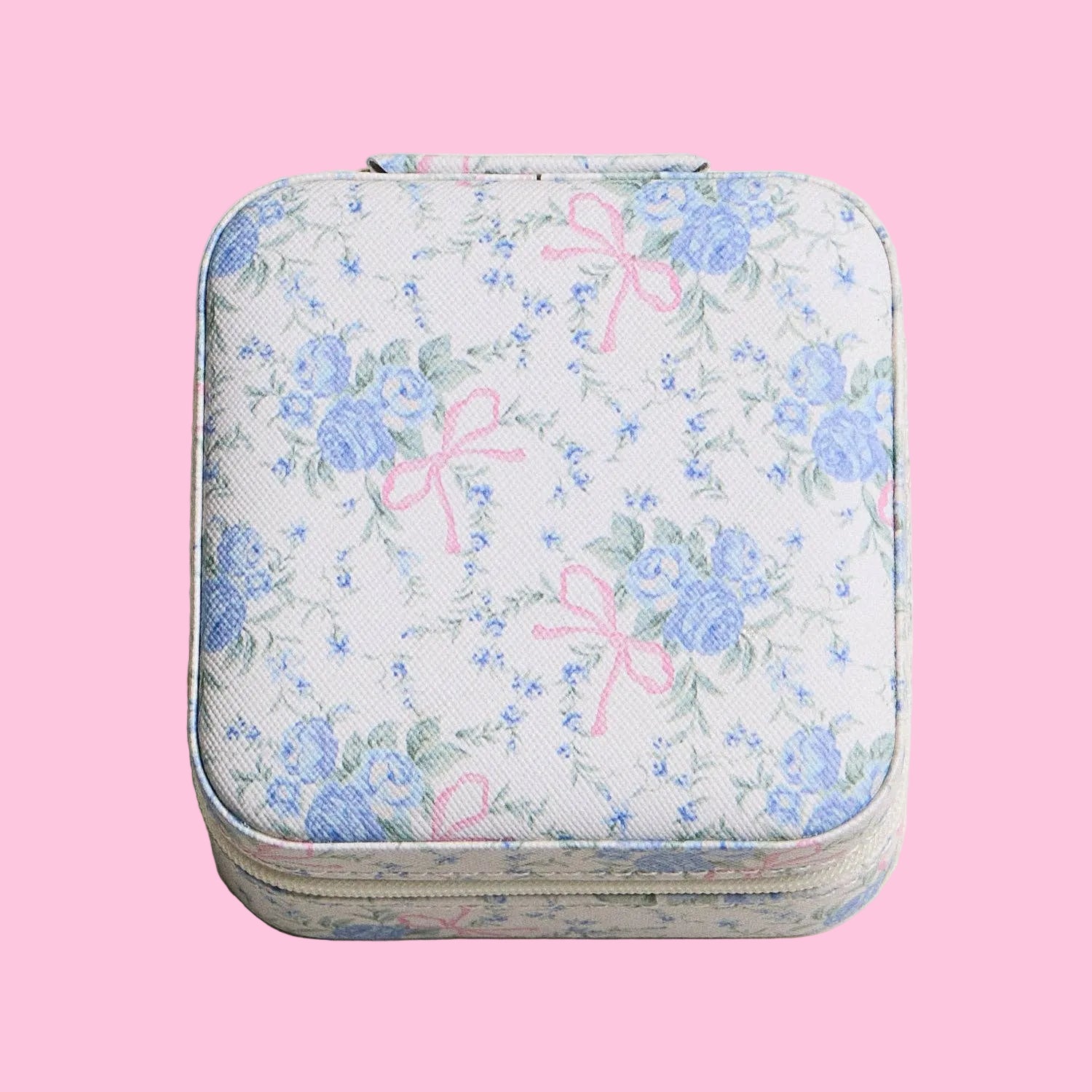 Floral patterned case with pink bows on a beige background