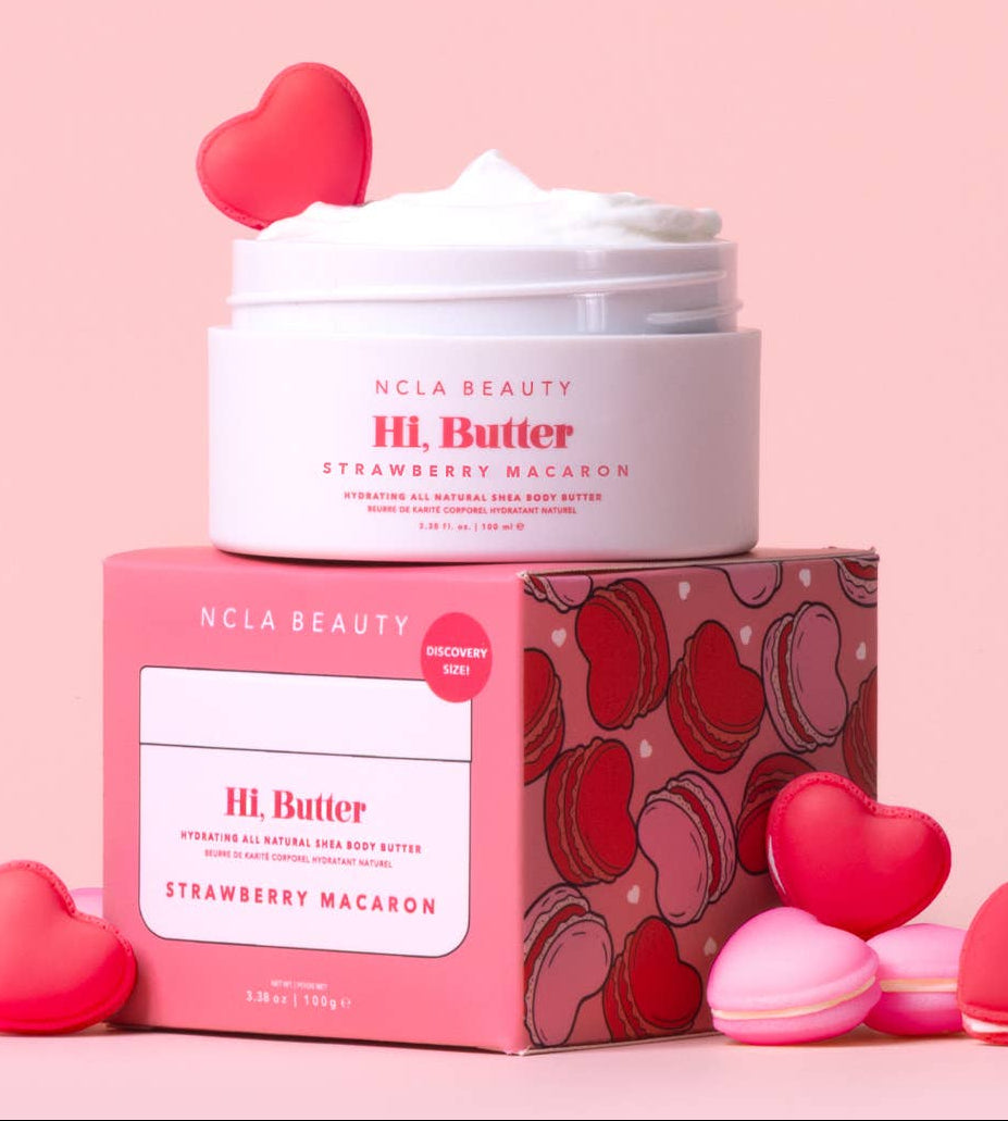 NCLA Beauty H.L. Butter Strawberry Macaron with pink packaging and heart-shaped macarons on a pink background