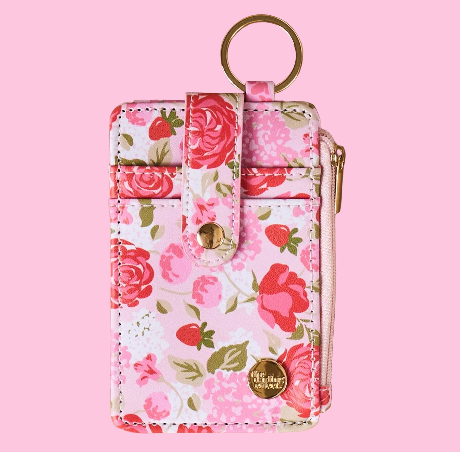 Floral patterned keychain pouch on a beige background