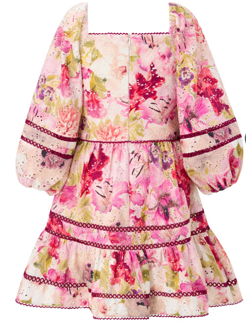 A girls short floral dress with a square neckline, voluminous puff sleeves, and a tiered skirt, featuring a pink, red, and green watercolor floral pattern on a cream background with dark red lace trim.