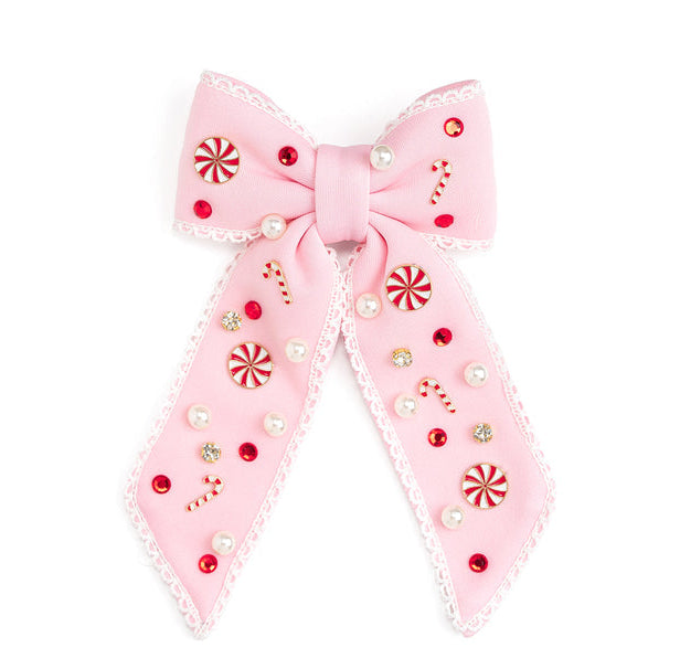 Pink Christmas bow hair clip with candy cane, peppermint, pearl and gemstone embellishments
