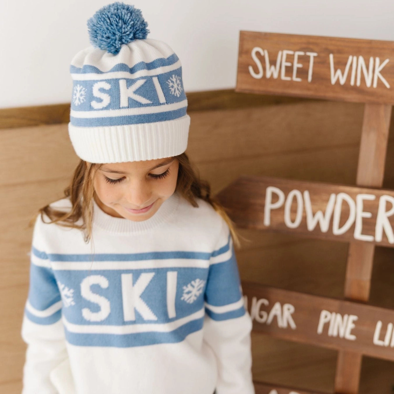 Sweet Wink Ski Beanie and matching sweater lifestyle image