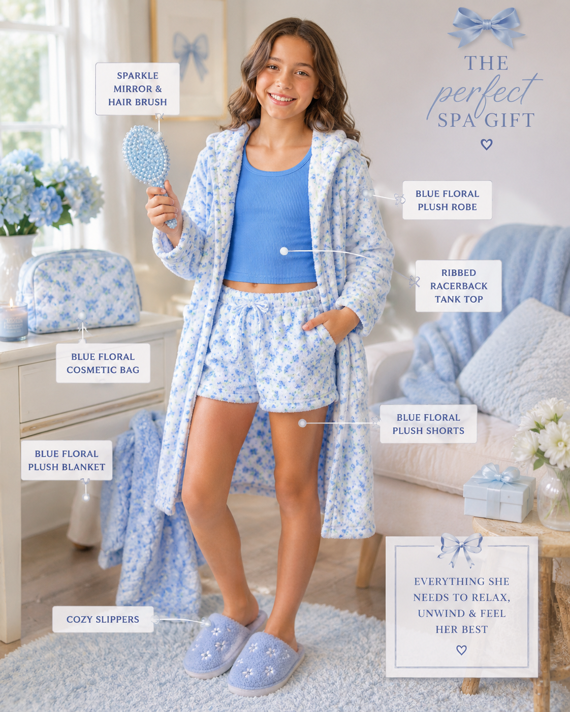 A tween girl stands in a bright bedroom setting wearing a coordinated spa gift set  by Iscream with a blue floral robe, tank top, shorts, and slippers, while holding a blue floral mirror. Multiple text callouts label included items such as the sparkly mirror, hair brush, blush bag, ribbed racetrack tank top, plush blanket, plush shorts, and cozy slippers.