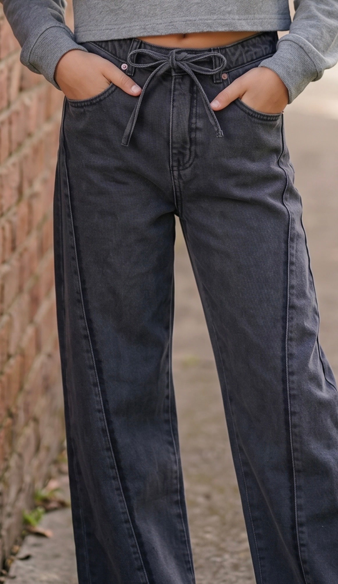 tween girls black low rise jeans in a wide leg style 